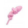 Plug queue de cochon rose vu sur queue tire-bouchon
